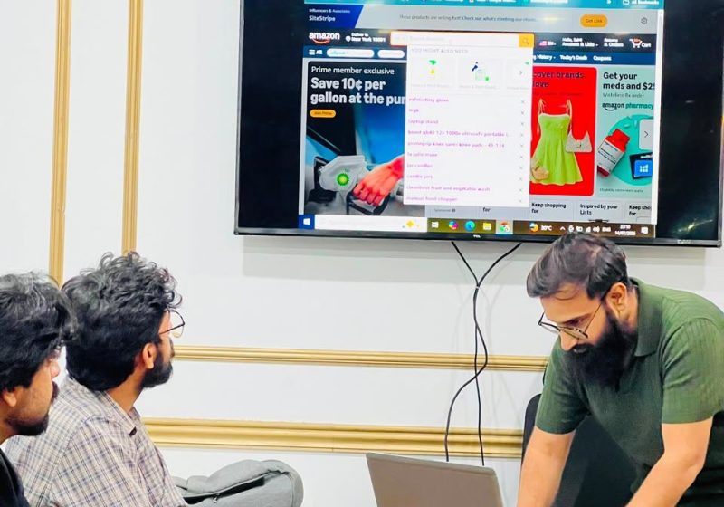 Trainer working at the laptop during a class
